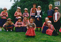 Marken c.1980 Children in different costumes with sunhats.