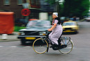 Spakenburg 1986. 'biking woman in traditional costume'