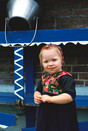 Staphorst 1987 'little girl before a wooden rack'
