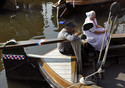Spakenburg 2012  Woman in traditional costume with husband on a 'Botter'