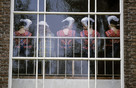 Staphorst 1980s 'young women in traditional costumes behind church window'